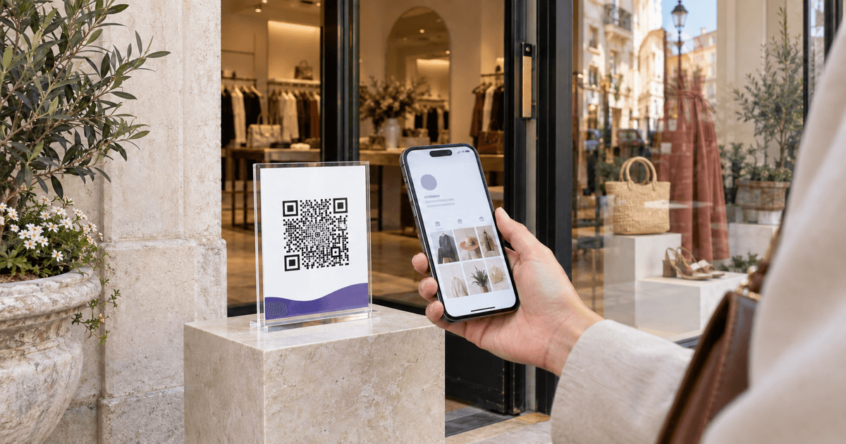 A boutique window display with a small Instagram profile QR card being scanned by a phone, with restrained violet accents and no readable brand text